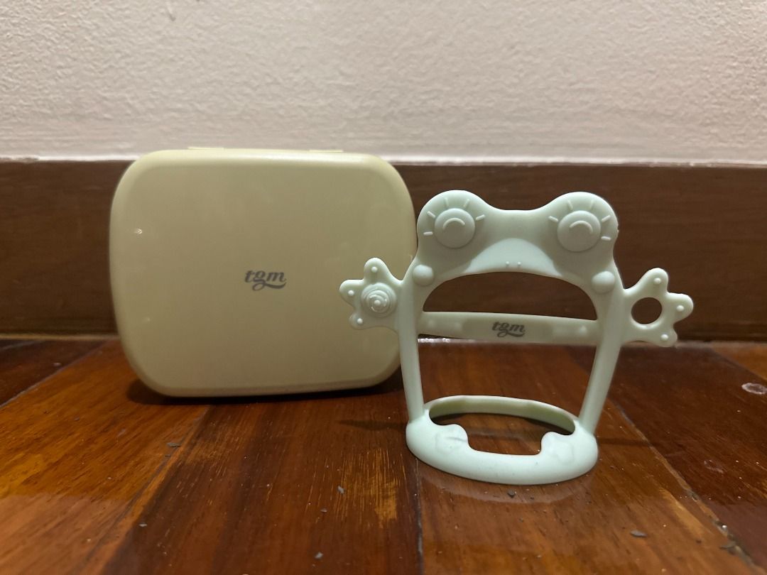 TGM Silicone Wristband Teether with Case, Mint Frog (Category: Soothers & Pacifiers) located in Makati City. Submitted by travelfinds34611 (Listing ID 1458976472, Image 2). Description: USED. GOOD CONDITION TGM Silicone Wristband Teether with Case - color/design: Mint Frog - comes with the original storage/carry case .
