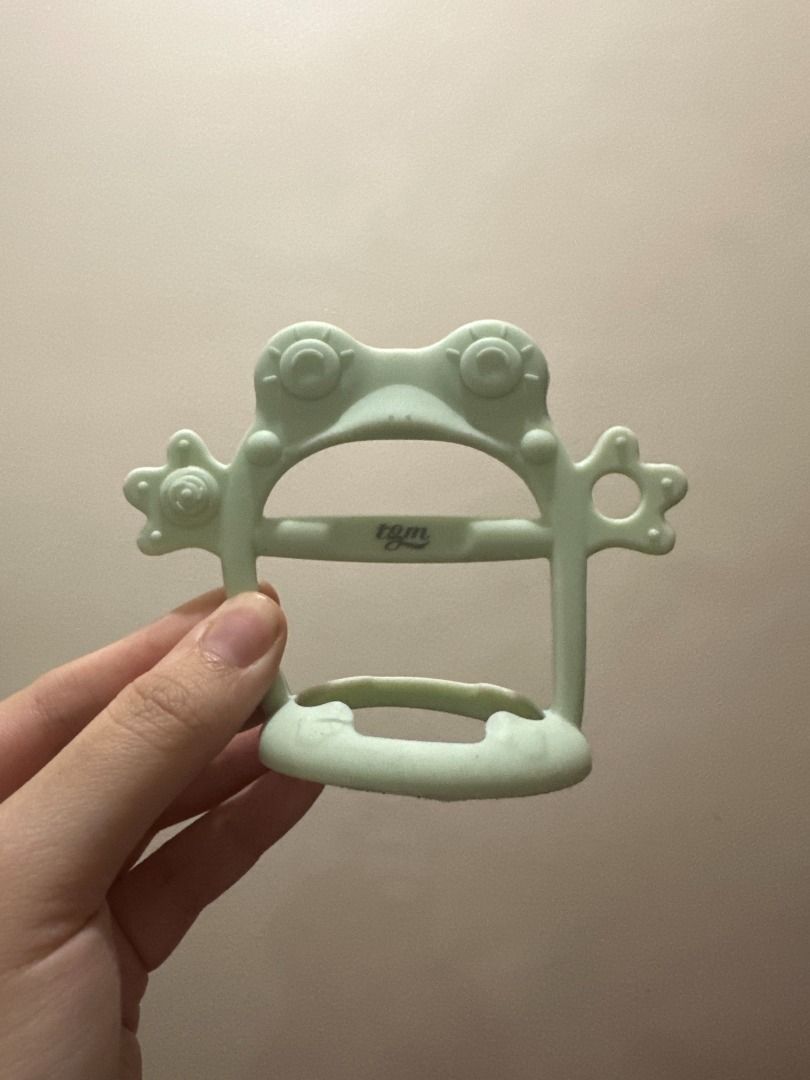 TGM Silicone Wristband Teether with Case, Mint Frog (Category: Soothers & Pacifiers) located in Makati City. Submitted by travelfinds34611 (Listing ID 1458976472, Image 3). Description: USED. GOOD CONDITION TGM Silicone Wristband Teether with Case - color/design: Mint Frog - comes with the original storage/carry case .