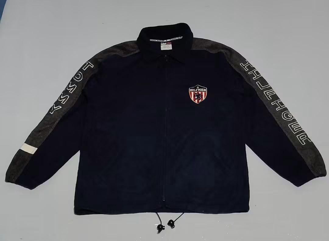 Tommy Hilfiger Fleece Jacket Navy Blue (Category: Coats, Jackets and Outerwear) located in Manila. Submitted by mariel_loise (Listing ID 1458986031, Image 1). Description: - Cool Tommy Hilfiger fleece jacket - Navy blue with grey sleeves - Tommy Hilfiger logo on the sleeve - Shield logo on the chest - Drawstring at the bottom hem - Great for casual wear -Dimes 22x28 can fil to XL.