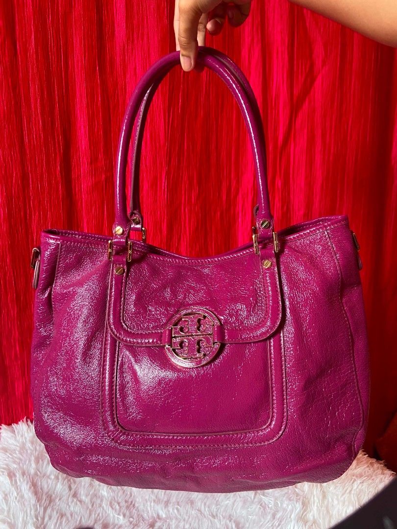 Tory Burch Amanda (Category: Luxury Bags & Wallets) located in Bulacan. Submitted by bella.ken.varietystore (Listing ID 1459016969, Image 1). Description: Authentic Tory Burch tote bag. Vibrant magenta patent leather. Gold hardware details. Interior has a zip pocket and slip pockets. Spacious main compartment. Great for everyday use or a pop of color..