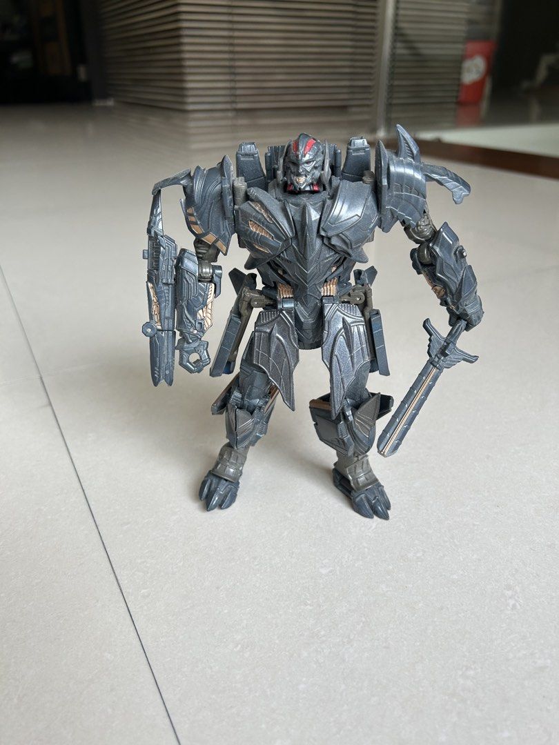 Transformers Megatron Action Figure Toy (Category: Action & Battle Toys) located in Quezon City. Submitted by dayanny (Listing ID 1458947947, Image 1). Description: - Movie accurate Megatron action figure - Includes sword and gun accessories - Poseable limbs for dynamic display - Minor scuffs from normal play - Ideal for any Transformers fan.