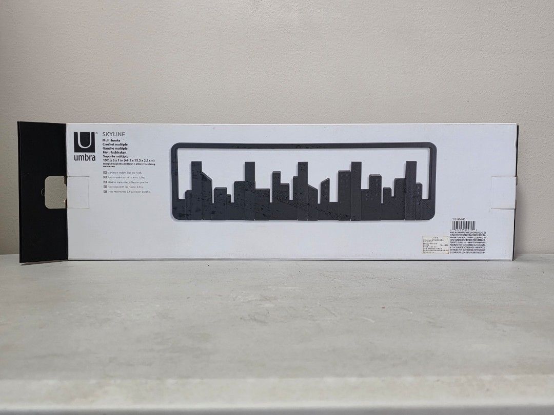Umbra Skyline Wall Hook Black Cityscape Design (Category: Wall Decor) located in Manila. Submitted by tch_86 (Listing ID 1459085907, Image 1). Description: - Umbra Skyline Wall Hook - Sleek black cityscape design - Multiple hooks fold down for convenience - Ideal for hanging coats, bags, scarves, and more - Easy wall mounting - Adds a cool urban vibe to your space - Comes in original packaging.