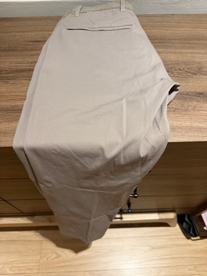 Uniqlo Beige Stretched Pants Size S (Category: Chinos) located in Muntinlupa City. Submitted by thrift_finds324 (Listing ID 1458998220, Image 1). Description: - Uniqlo Beige stretched Pants - Size: S - Origin: Made in Vietnam - Fit: Comfortable for everyday wear - Style: Great for casual or smart-casual outfits - Versatility: Easy to pair with various tops.