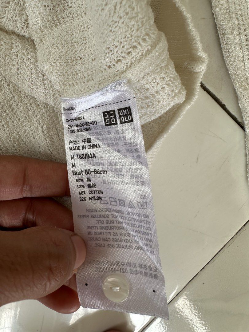 Uniqlo cardigan white (Category: Coats, Jackets and Outerwear) located in Manila. Submitted by marielpit11241 (Listing ID 1459014705, Image 3). Description: Authentic Size M on tag Good as new condition No issue Location: Guadalupe.