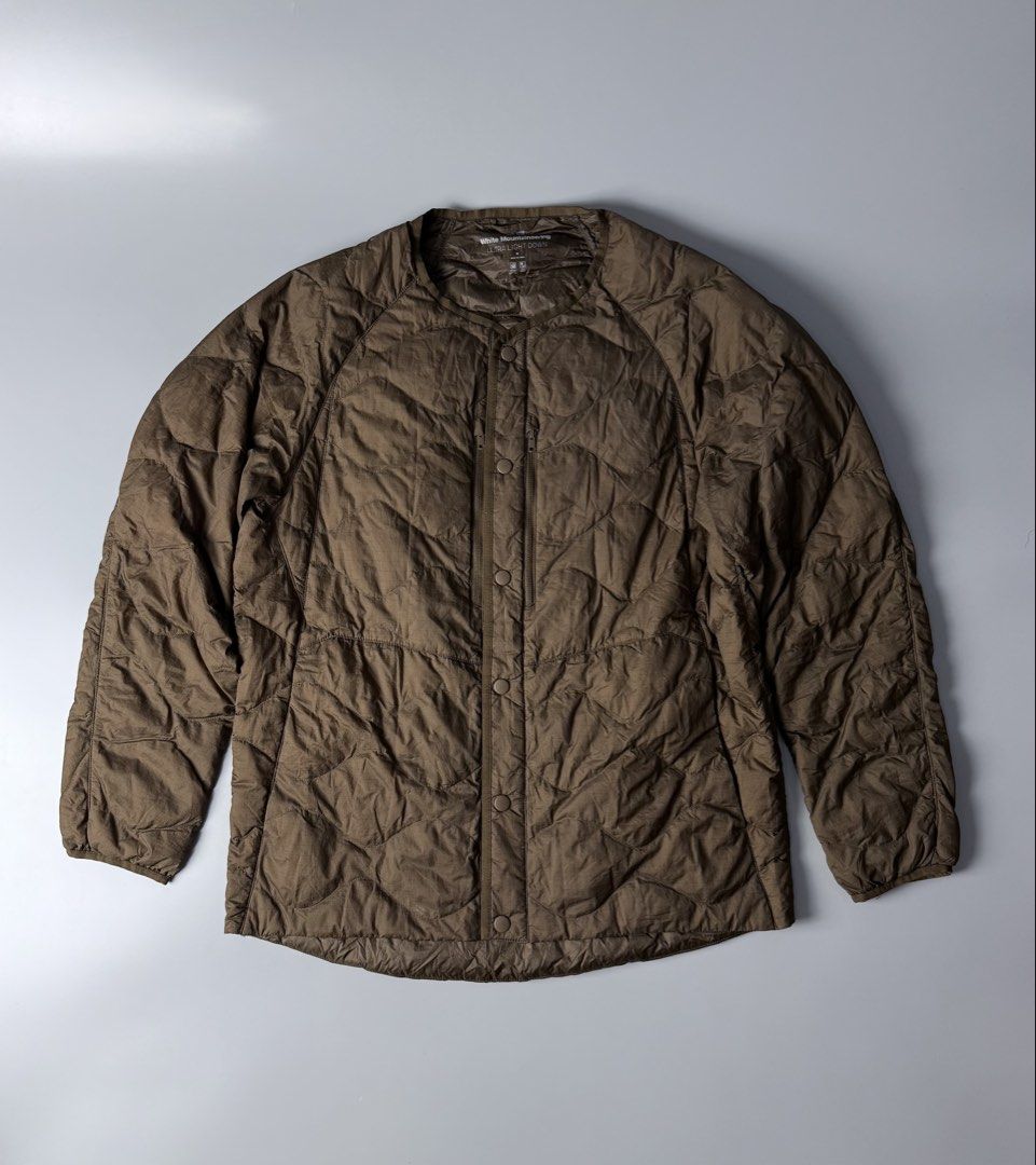 Uniqlo x White Mountaineering Packable Lightweight Puffer Jacket (Category: Coats, Jackets and Outerwear) located in San Pablo. Submitted by zzz.archvs (Listing ID 1459085780, Image 1). Description: Still in excellent condition No any flaw Zippers and buttons still working great Measurements pn pictures Lightweight Packable.