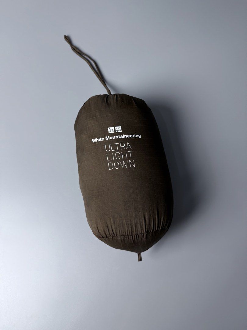 Uniqlo x White Mountaineering Packable Lightweight Puffer Jacket (Category: Coats, Jackets and Outerwear) located in San Pablo. Submitted by zzz.archvs (Listing ID 1459085780, Image 2). Description: Still in excellent condition No any flaw Zippers and buttons still working great Measurements pn pictures Lightweight Packable.