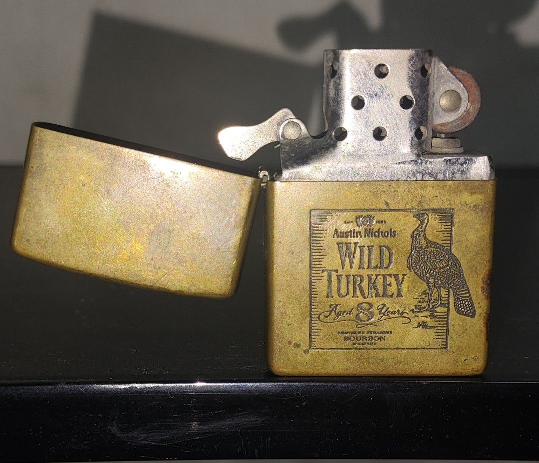 vintage 2000 brass Zippo lighter (Category: Vintage Collectibles) located in Manila. Submitted by thrifts_style (Listing ID 1459084471, Image 1). Description: vintage 2000 brass Zippo lighter featuring an etched Wild Turkey bourbon label.