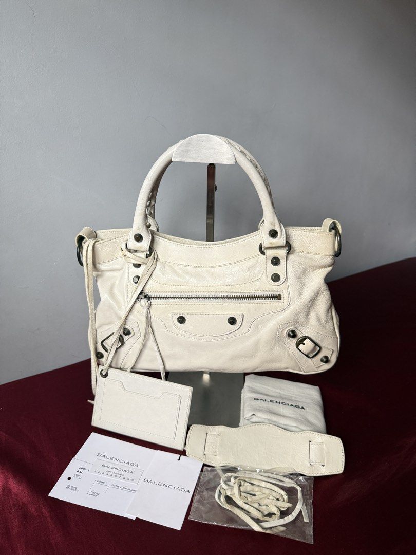 SOLD Vintage Balenciaga First (Category: Luxury Bags & Wallets) located in Bacoor. Submitted by mikaysu (Listing ID 1459079727, Image 1). Description: Iconic early Balenciaga motorcycle bag featuring signature distressed leather, front zip pocket, buckle detailing, top handles and detachable shoulder strap. Complete set - includes: Original shoulder strap Original mirror Dust bag Controllato cards Extra tassels Condition: There are some yellow st