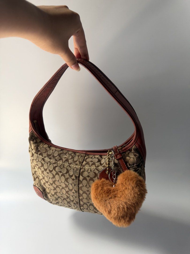 (SOLD) Vintage Coach Ergo Shoulder Bag (Category: Shoulder Bags) located in Mandaluyong City. Submitted by n444m (Listing ID 1458945142, Image 2). Description: Vintage Coach Ergo Shoulder Bag (Reposted) -Has flaws, can cover up using patches -free charm -negotiable :)).