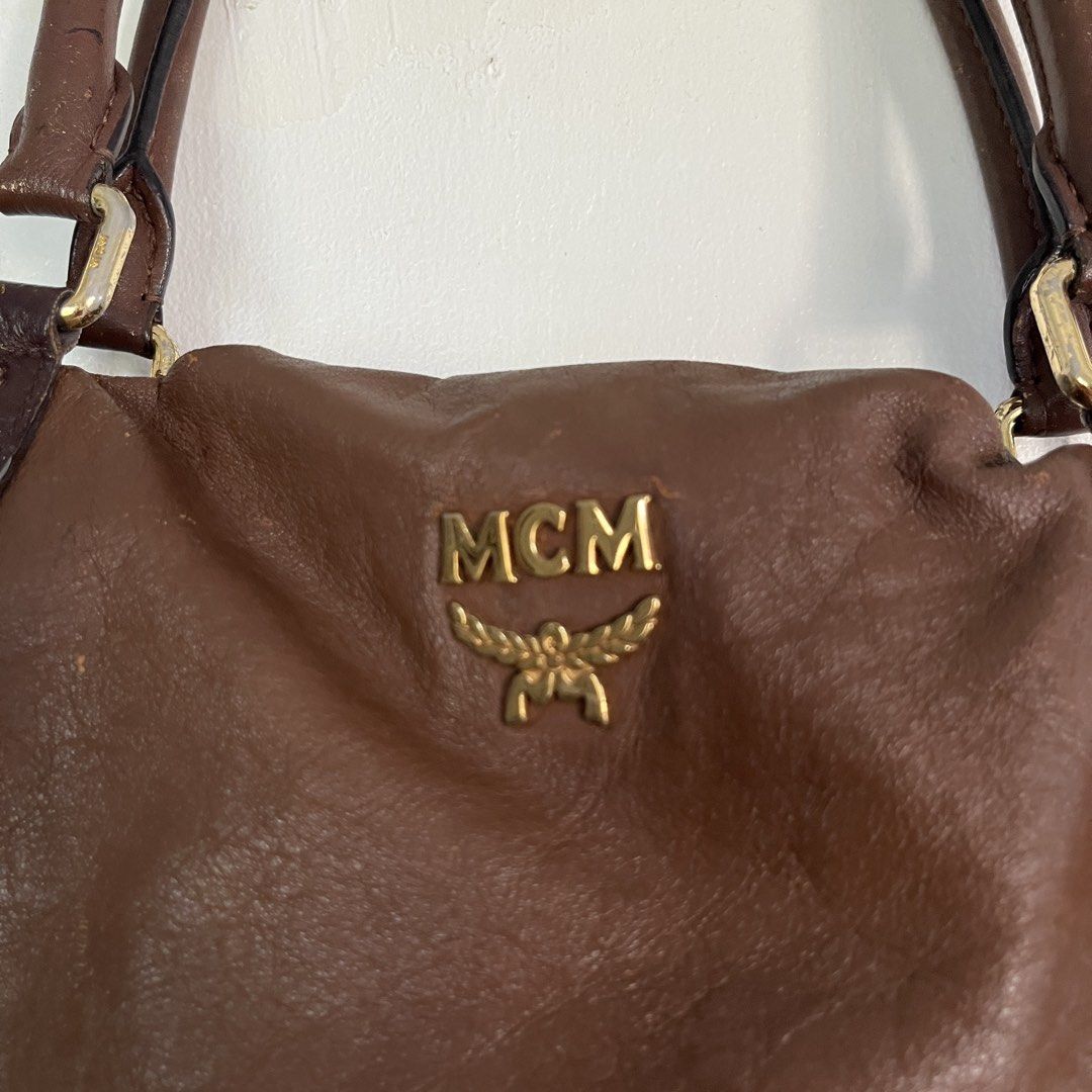 Vintage MCM Brown Leather Shoulder Bag (Category: Luxury Bags & Wallets) located in Las Pinas. Submitted by solfits (Listing ID 1458899730, Image 2). Description: - Authentic MCM shoulder bag in classic brown leather. - Elegant gold-tone hardware. - Secure zipper closure on the side. - Signs of usage on leather & hardware..