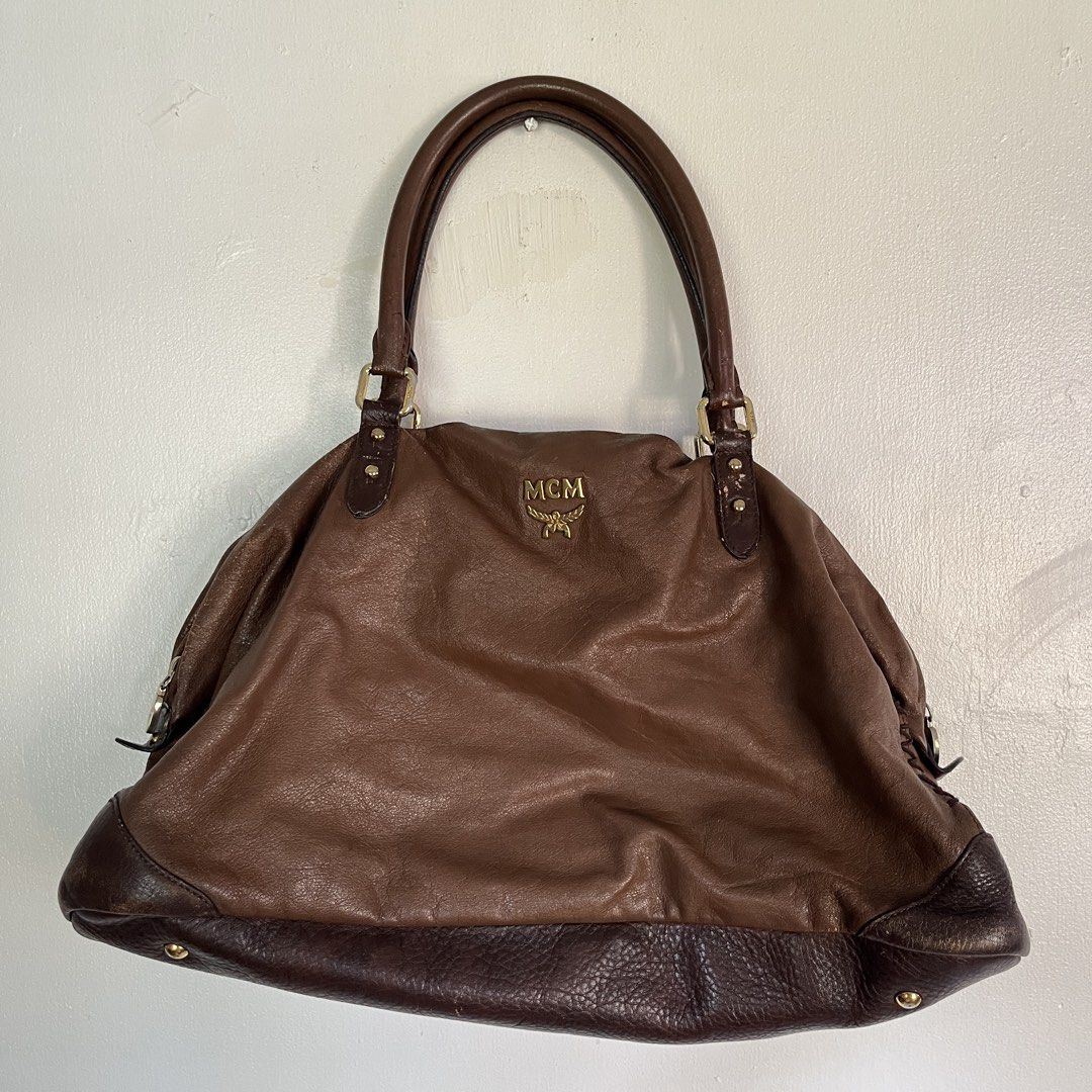 Vintage MCM Brown Leather Shoulder Bag (Category: Luxury Bags & Wallets) located in Las Pinas. Submitted by solfits (Listing ID 1458899730, Image 1). Description: - Authentic MCM shoulder bag in classic brown leather. - Elegant gold-tone hardware. - Secure zipper closure on the side. - Signs of usage on leather & hardware..