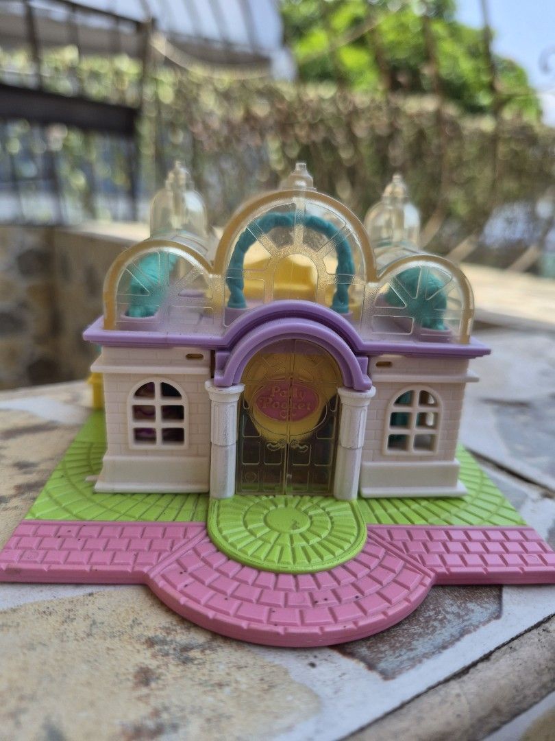 Vintage Polly Pocket Compact House Toy (Category: Kids Toys) located in Antipolo. Submitted by prinsesa_dianne (Listing ID 1458902017, Image 1). Description: - Adorable compact house playset - Opens to reveal tiny rooms and furniture - Comes with accessories like a bed, table, and chairs - Encourages imaginative play - Folds up for easy storage and portability - Ideal for collectors or kids who enjoy small toys.