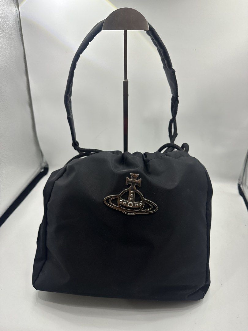 Vivienne Westwood Black Nylon Drawstring Bag (Category: Luxury Bags & Wallets) located in Baguio. Submitted by luxukayukay (Listing ID 1458979604, Image 3). Description: - Authentic Vivienne Westwood Drawstring Bag - Material: Black Nylon - Iconic Orb Logo on Front - Made in Italy - Metal Feet on Bottom for Durability - Secure Drawstring Closure - Ideal for Everyday Carry.