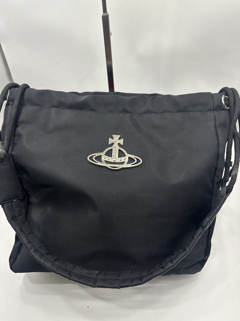 Vivienne Westwood Black Nylon Drawstring Bag (Category: Luxury Bags & Wallets) located in Baguio. Submitted by luxukayukay (Listing ID 1458979604, Image 1). Description: - Authentic Vivienne Westwood Drawstring Bag - Material: Black Nylon - Iconic Orb Logo on Front - Made in Italy - Metal Feet on Bottom for Durability - Secure Drawstring Closure - Ideal for Everyday Carry.