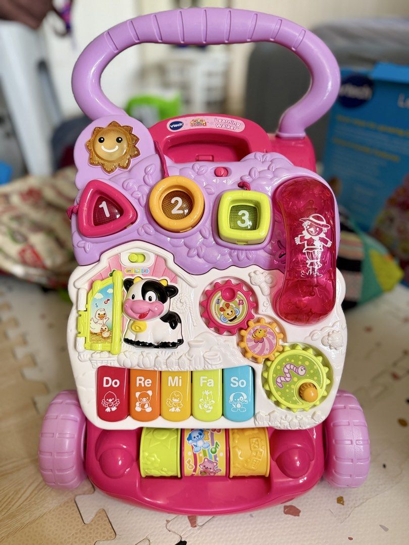 VTech Sit-to-Stand Learning Walker Pink Musical Toy (Category: Infant Playtime) located in Marikina City. Submitted by ishietorio (Listing ID 1458913449, Image 2). Description: Excellent used condition and cleaned before packing back to its box. Looks almost new! Makintab pa All buttons are still working. Lights and sounds are all working perfectly. Para kang bumili ng bago sa mall but with a very low price. I can send you videos as proof of curr