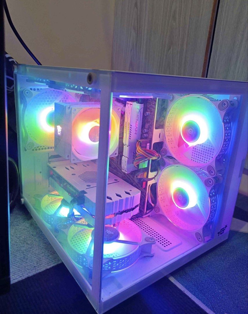 White MATX CASE with RGB Fans (Category: Desktops) located in Camiling. Submitted by notroobbss (Listing ID 1459084303, Image 1). Description: - White ATX PC Case - Multiple RGB Fans for cooling and aesthetics - Tempered Glass Side Panel to showcase your components - RGB Lighting on top panel mesh - Ideal for a gaming PC setup - Ready to install your motherboard, GPU, and other parts.