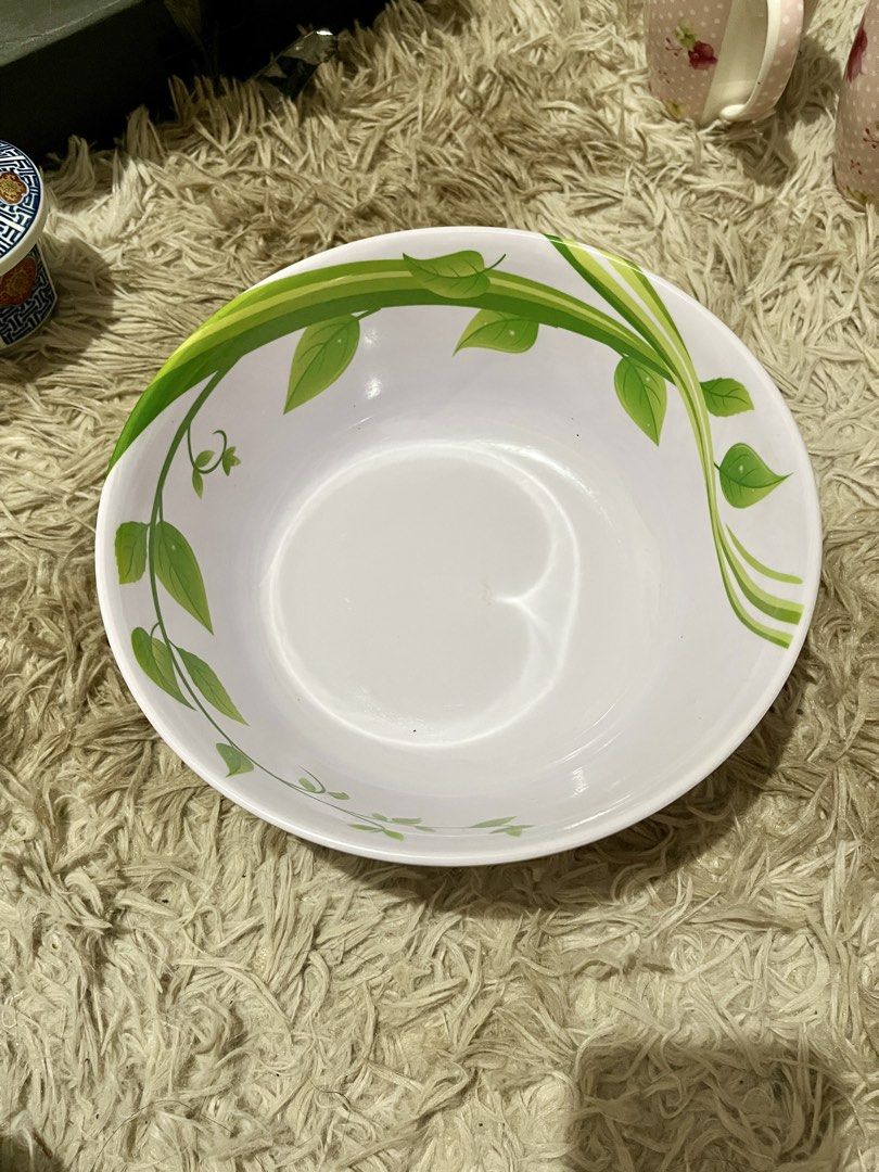 White Melamine Bowl with Green Leaf Design (Category: Other Kitchenware & Tableware) located in Pasig City. Submitted by samotsari (Listing ID 1459025750, Image 1). Description: - White melamine bowl - Features a pretty green leaf vine design around the rim - Great for serving salads, snacks, or as a general-purpose bowl - Durable and lightweight material - Perfect for everyday use or outdoor gatherings - Unused, just stored .