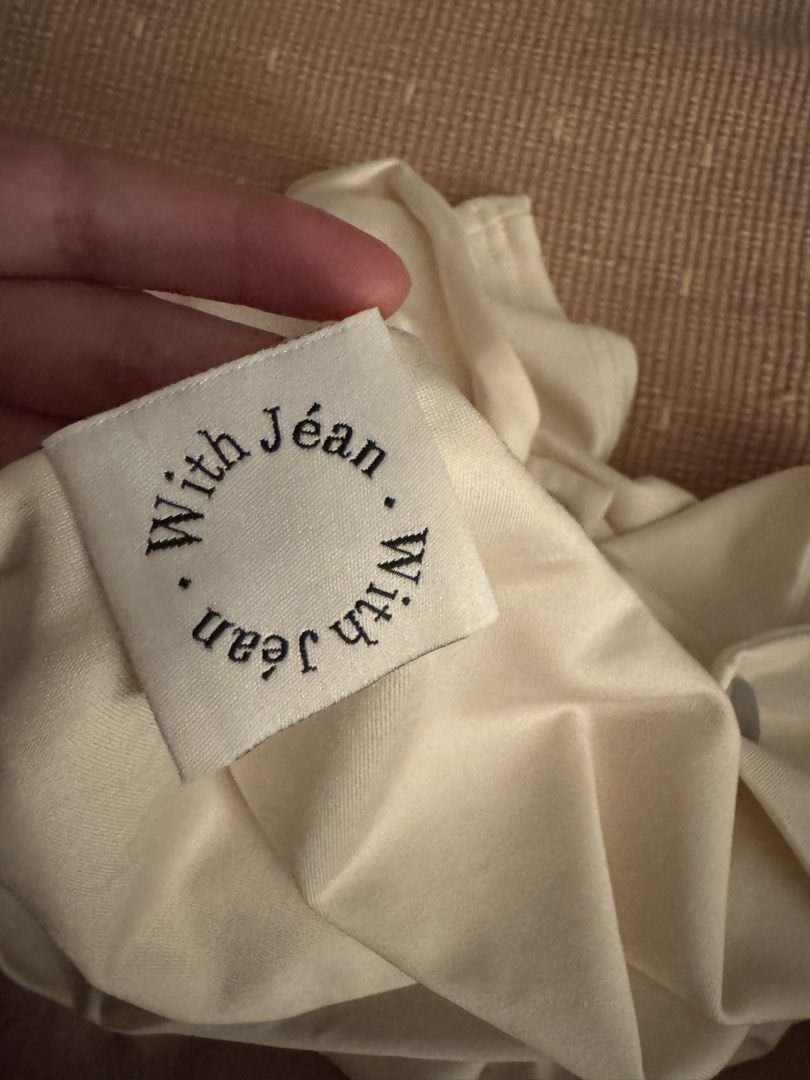 [SOLD] WITH JEAN Cream Drape Button Front Top (Category: Sleeveless) located in San Juan City. Submitted by sfvr. (Listing ID 1459003293, Image 2). Description: - Cream top from WITH JEAN -size xs - Draped neckline - Button front detail - Short sleeves with button accents - Pairs well with skirts or trousers - Comfortable and stylish for any occasion Only used once. Originally bought for 2500. Can’t vouch for its authenticity..