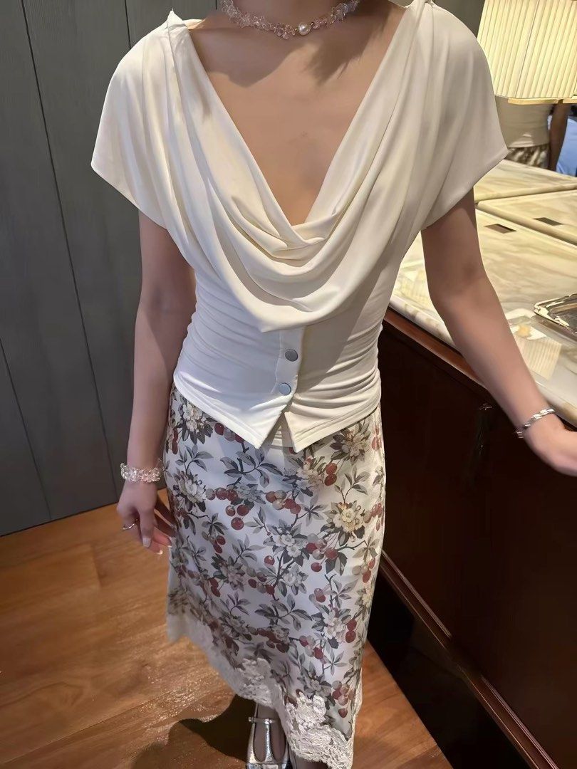 [SOLD] WITH JEAN Cream Drape Button Front Top (Category: Sleeveless) located in San Juan City. Submitted by sfvr. (Listing ID 1459003293, Image 1). Description: - Cream top from WITH JEAN -size xs - Draped neckline - Button front detail - Short sleeves with button accents - Pairs well with skirts or trousers - Comfortable and stylish for any occasion Only used once. Originally bought for 2500. Can’t vouch for its authenticity..