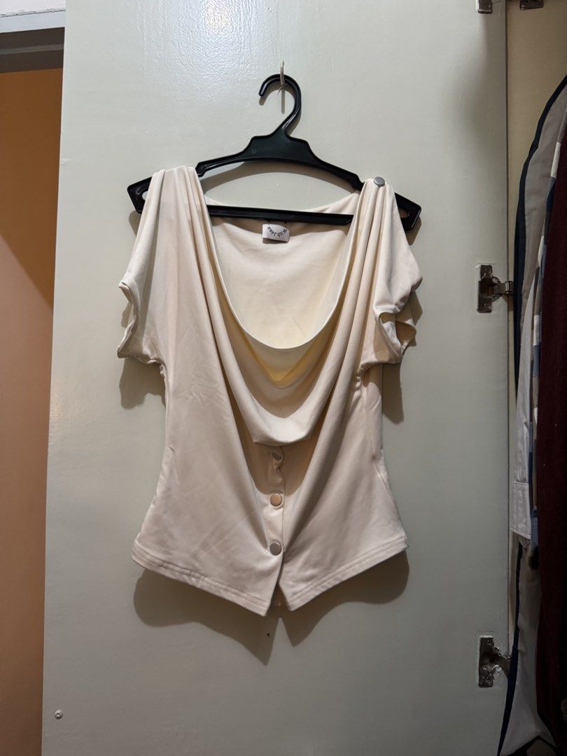 [SOLD] WITH JEAN Cream Drape Button Front Top (Category: Sleeveless) located in San Juan City. Submitted by sfvr. (Listing ID 1459003293, Image 3). Description: - Cream top from WITH JEAN -size xs - Draped neckline - Button front detail - Short sleeves with button accents - Pairs well with skirts or trousers - Comfortable and stylish for any occasion Only used once. Originally bought for 2500. Can’t vouch for its authenticity..