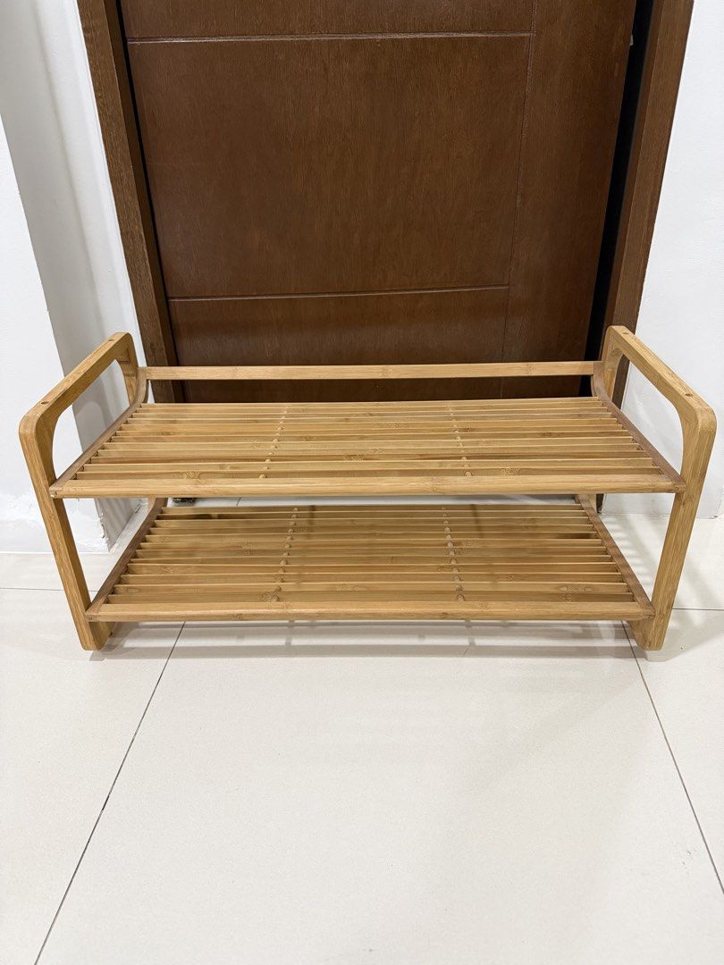 Imported Wooden 2-Tier Shoe Rack (Category: Shelves, Cabinets & Racks) located in Cavite. Submitted by jazz.shop (Listing ID 1459013540, Image 2). Description: - Made of durable bamboo - Features two spacious shelves - Convenient side handles for easy transport - Ideal for organizing shoes by the door or in closets - Simple, natural wood aesthetic complements any decor - Compact design fits easily into various spaces.