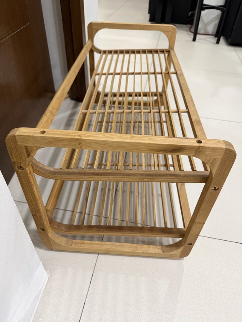 Imported Wooden 2-Tier Shoe Rack (Category: Shelves, Cabinets & Racks) located in Cavite. Submitted by jazz.shop (Listing ID 1459013540, Image 3). Description: - Made of durable bamboo - Features two spacious shelves - Convenient side handles for easy transport - Ideal for organizing shoes by the door or in closets - Simple, natural wood aesthetic complements any decor - Compact design fits easily into various spaces.