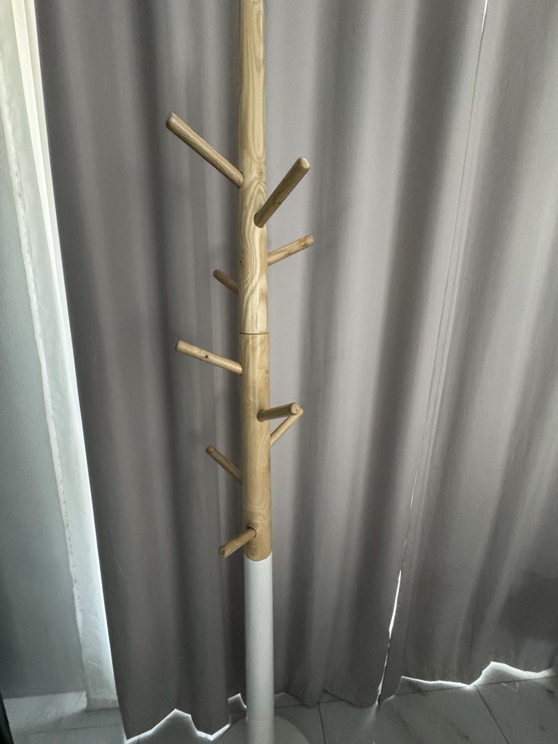 Wooden Tree Branch Style Coat Rack Stand (Category: Other Home Furniture) located in Manila. Submitted by decluterthings888 (Listing ID 1458917250, Image 1). Description: - Stylish coat rack with natural wood finish - Multiple branches for hanging coats, scarves, hats, etc. - Clean white base for a modern contrast - Ideal for entryways or bedrooms - Easy to assemble and move.