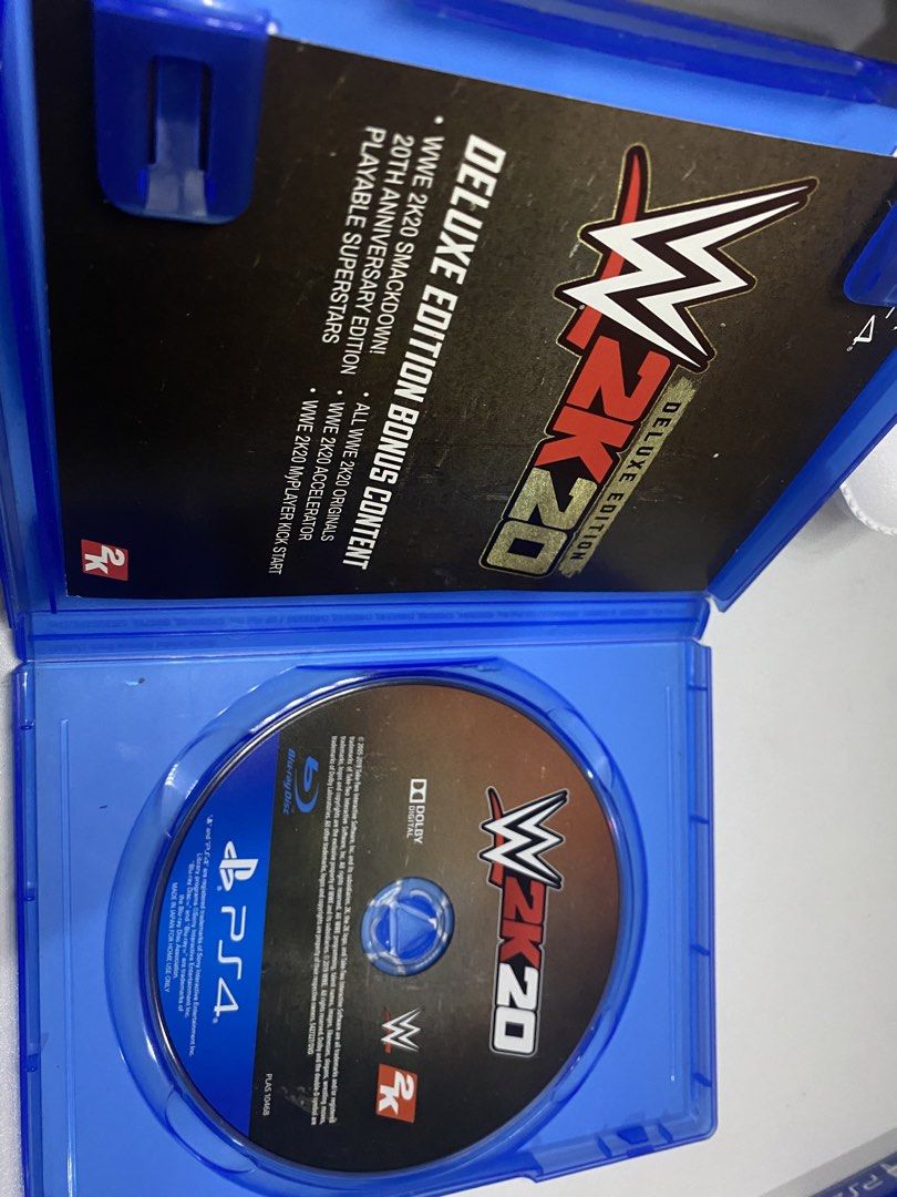 WWE 2K20 Deluxe Edition PS4 Game (Category: PlayStation) located in Manila. Submitted by francisnitsuga (Listing ID 1458989847, Image 2). Description: WWE 2K20 Deluxe Edition for PS4. Includes bonus content like 2K20 Originals, WWE 2K20 Originals Accelerator, and WWE 2K20 MyPLAYER Attribute Boosts. Great for wrestling fans. has minor scratches in the case but good condition for disk.