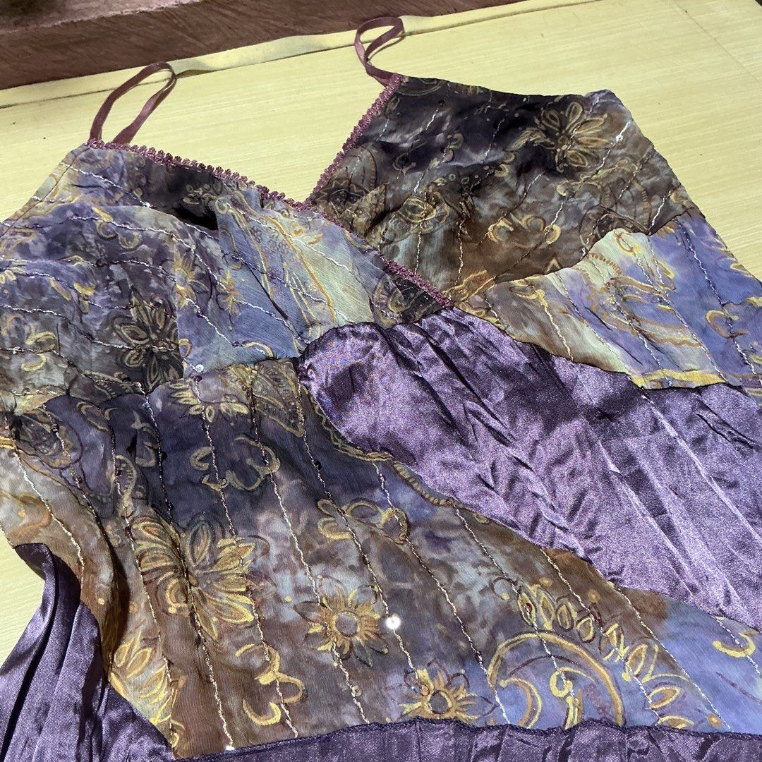 Y2K Patchwork Print Camisole Asymmetrical Top (Category: Sleeveless) located in Manila. Submitted by daisyparl (Listing ID 1458936556, Image 3). Description: - Unique patchwork camisole top - Mix of floral and solid purple prints - V-neckline with beaded trim - Adjustable spaghetti straps - Lightweight fabric, perfect for layering or solo wear - Fun and colorful addition to your wardrobe.