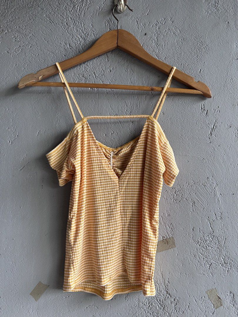 Yellow Gingham Cold Shoulder Ruched Crop Top (Category: Blouses) located in Binan City. Submitted by forgetmenot_ph (Listing ID 1458996656, Image 2). Description: - Cute yellow and white gingham pattern - Ruched front detail - Cold shoulder sleeves - Thin spaghetti straps - Ribbed fabric texture - Pairs well with high-waisted jeans or shorts - Ideal for casual outings and summer vibes.