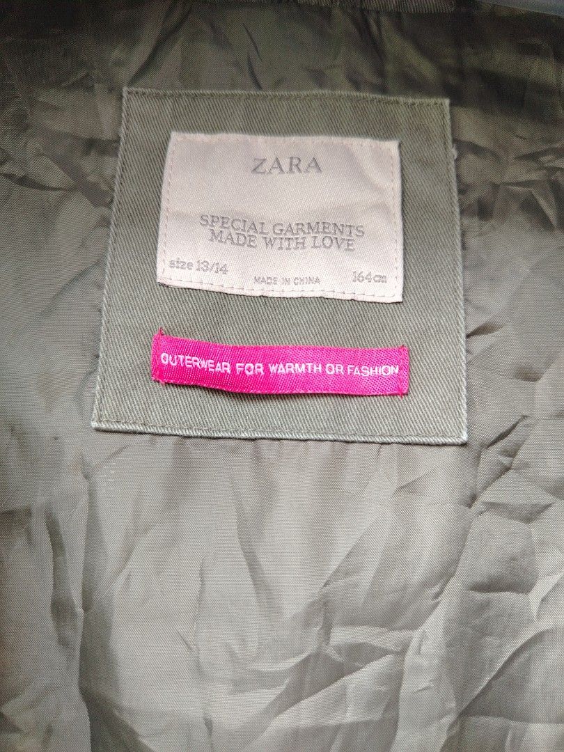 Zara Khaki Hooded Jacket 13/14 (Category: Activewear) located in Davao. Submitted by enchanted08 (Listing ID 1458933857, Image 3). Description: - Zara Khaki Green Parka Jacket - Size: 13/14 (fits 164cm height) - Features: Hood, zip and button closure, pockets - Style: Outerwear for warmth and fashion - Ideal for: Cooler weather.
