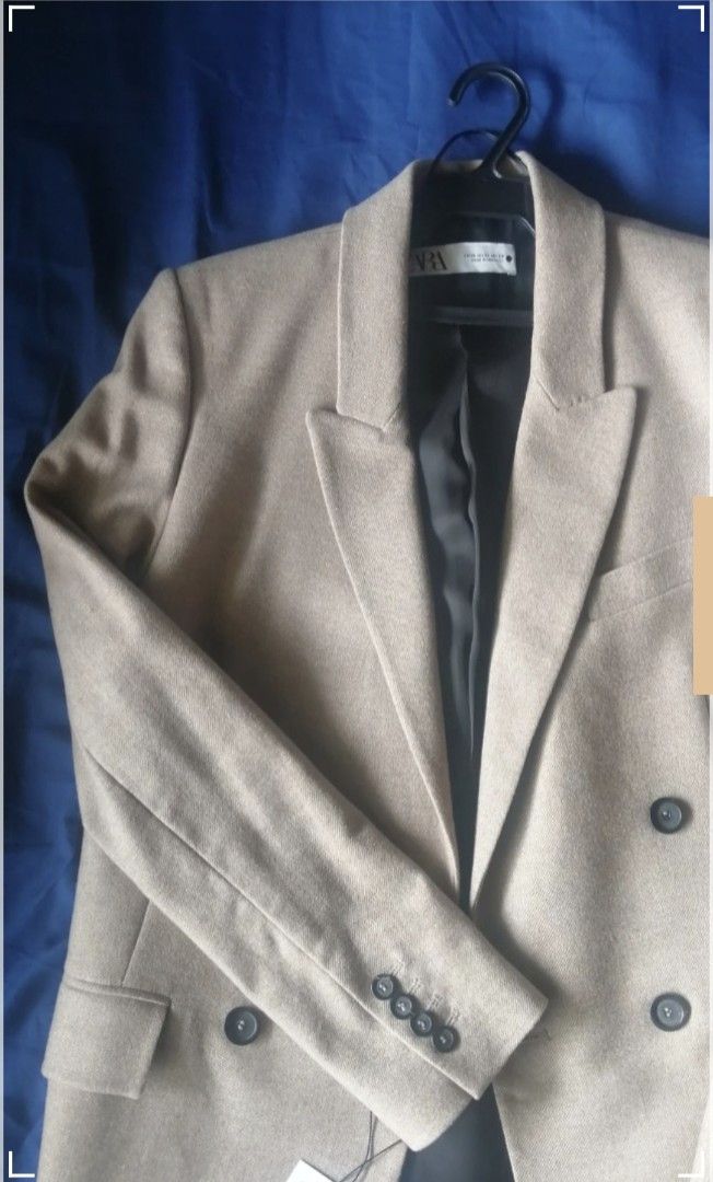 ZARA Oversize Wool Blend Blazer Beige (Category: Coats, Jackets and Outerwear) located in Manila. Submitted by closet_purging (Listing ID 1458942164, Image 3). Description: - Beige oversized blazer from ZARA - Double-breasted with button closure - Ideal for layering over any outfit - Features functional pockets - Brand new with original tags attached RFS: Size too big Disclaimer: The fabric feels itchy because of the wool. It needs to be treated 