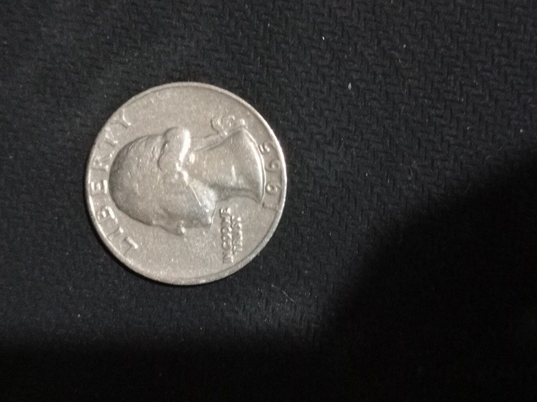 1965 US Quarter Coin - Liberty (Category: Currency) located in Manila. Submitted by luckyeagle-7ff8 (Listing ID 1460746010, Image 3). Description: - 1965 US Quarter - Features George Washington on the obverse - Clearly visible year '1965' - Collectible coin for numismatists - Great addition to any coin collection.
