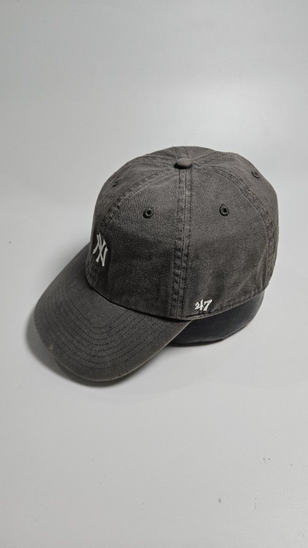 47 Brand New York Yankees Baseball Cap (Category: Caps & Hats) located in Alfonso. Submitted by jbcamet (Listing ID 1460829849, Image 2). Description: - Grey New York Yankees cap - Classic 'NY' logo embroidered on the front - '47' logo on the side - Adjustable strap at the back for a comfortable fit - Made by 47 Brand - One size fits all.