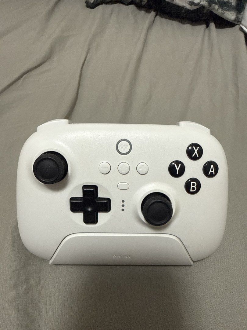 8BitDo Controller (Category: Controllers) located in Singapore. Submitted by kuehber (Listing ID 1460882543, Image 1). Description: - White 8BitDo Pro 2 Controller - Compatible with Nintendo Switch - Full standard buttons and joysticks - Comes with charging dock - Ideal for gaming at home or on the go.