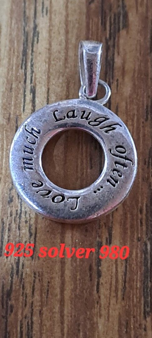 925 Silver Pendant "Laugh often Love much" (Category: Charms) located in Davao. Submitted by bravemoon_556cd5 (Listing ID 1460839203, Image 1). Description: - Genuine 925 Sterling Silver pendant - Engraved with 'Laugh often Love much' - Elegant and simple classic design - Ideal for everyday wear - Makes a thoughtful gift - A must-have addition to your jewelry collection.