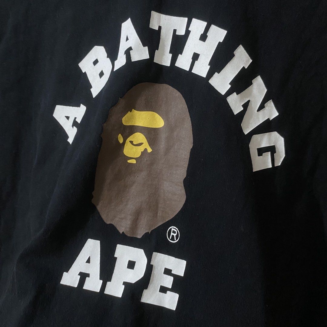 A Bathing Ape BAPE College Logo Shirt (Category: Tshirts & Polo Shirts ) located in Manila. Submitted by 4114thrifts.ph (Listing ID 1460875489, Image 2). Description: Item Name: A Bathing Ape BAPE College Logo Shirt (Details) • Size: Small on tag • Dimes: 20x26 • Color Rate: 9.4/10 • Issue/s: Need Wash Only Mine: 1,050 Free Shipping 📥 Dasmariñas City, Cavite, 4114📍.