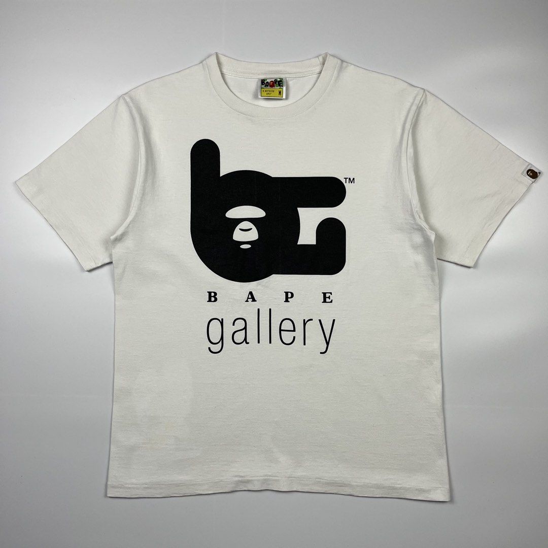 A Bathing Ape ‘Bape Gallery’ OG 2000’s Tee (Category: Tshirts & Polo Shirts ) located in Puerto Princesa. Submitted by paradise5300 (Listing ID 1460760968, Image 1). Description: A Bathing Ape ‘Bape Gallery’ OG 2000’s Tee Tagged Size: Medium Dimensions Inches length: 26 Inches width: 19 Condition: Excellent Color rate: 9.5 Flaws: None 2,499 shipping fee is not yet included. .
