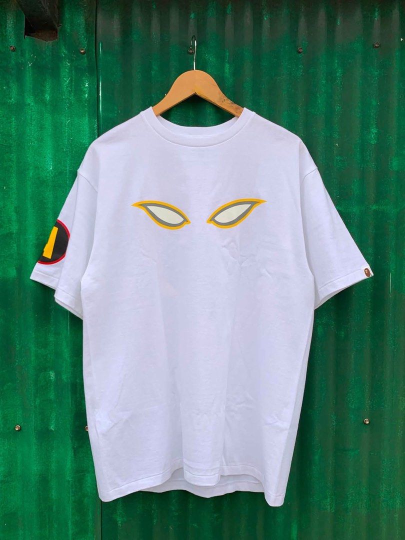 A Bathing Ape x DC Comics Batman Classic Collection Tee (Category: Tshirts & Polo Shirts ) located in Quezon City. Submitted by lancegio27 (Listing ID 1460763468, Image 2). Description: - White A Bathing Ape tee from the Classic Collection - Features Batman's eyes graphic on the front - Gorilla/bat symbol graphic on the back - 'A' logo detail on the sleeve - Made in Japan - Ideal for fans of BAPE and Batman.