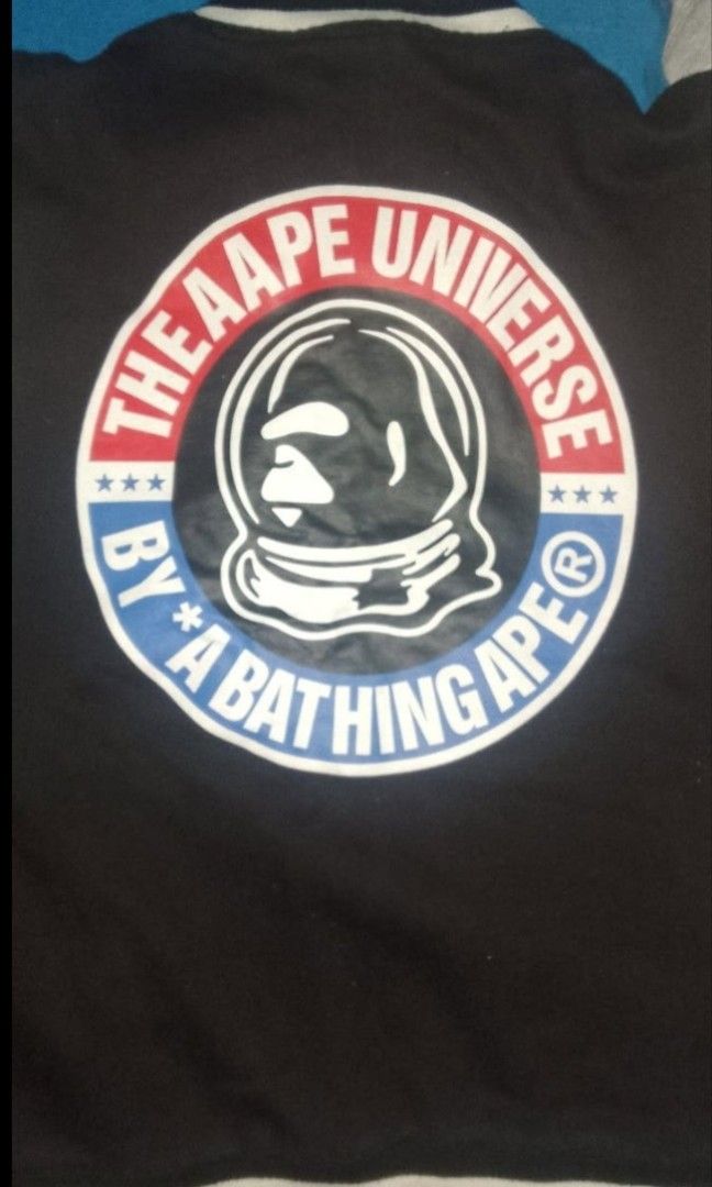 AAPE BY A BATHING APE Varsity Jacket (Category: Coats, Jackets and Outerwear) located in Muntinlupa City. Submitted by zlysiea (Listing ID 1459957005, Image 2). Description: - Brand: AAPE - Style: Varsity Jacket - Color: Black and White - Size: S - Features: AAPE logo on sleeve, American flag graphic - Ideal for: Streetwear collection.