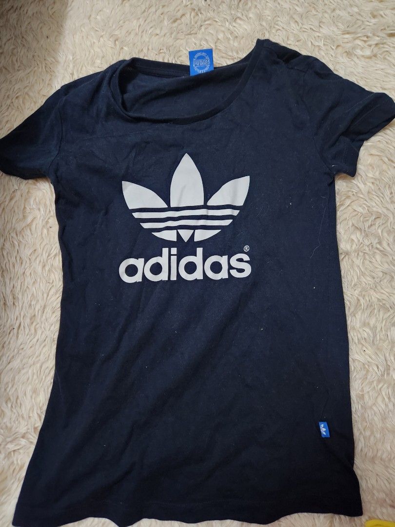 Adidas black shirt top (Category: Shirts) located in Quezon City. Submitted by decluttering.cat (Listing ID 1460905191, Image 1). Description: note: pls refer to measurements, no when worn -no major flaws, lints & holes, or stains -only needs rewash.
