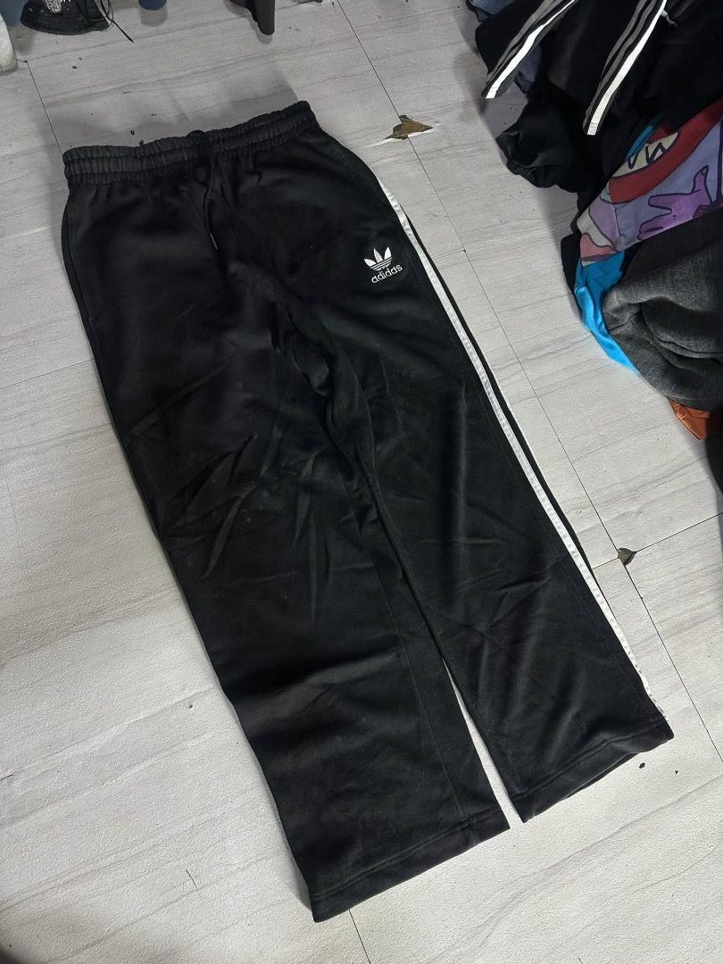 Adidas Black Track Pants with White Stripes (Category: Other Bottoms) located in Manila. Submitted by nb_thriftshop (Listing ID 1460891589, Image 1). Description: adi sweat pants waist 25 to 30 length 38 leg hole 9 no issue need wash.