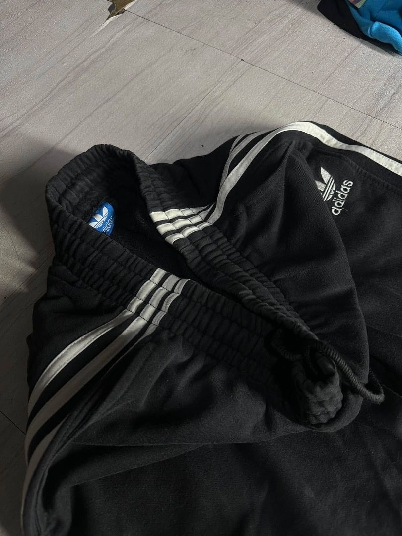 Adidas Black Track Pants with White Stripes (Category: Other Bottoms) located in Manila. Submitted by nb_thriftshop (Listing ID 1460891589, Image 2). Description: adi sweat pants waist 25 to 30 length 38 leg hole 9 no issue need wash.