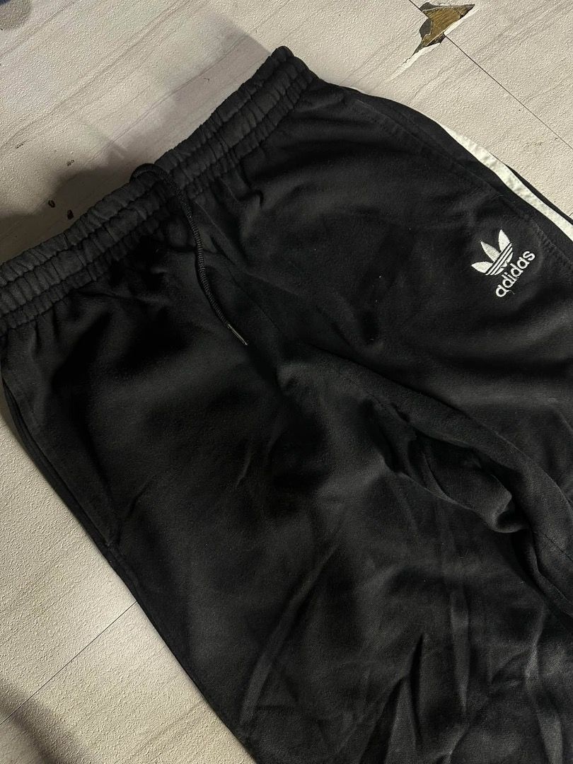 Adidas Black Track Pants with White Stripes (Category: Other Bottoms) located in Manila. Submitted by nb_thriftshop (Listing ID 1460891589, Image 3). Description: adi sweat pants waist 25 to 30 length 38 leg hole 9 no issue need wash.