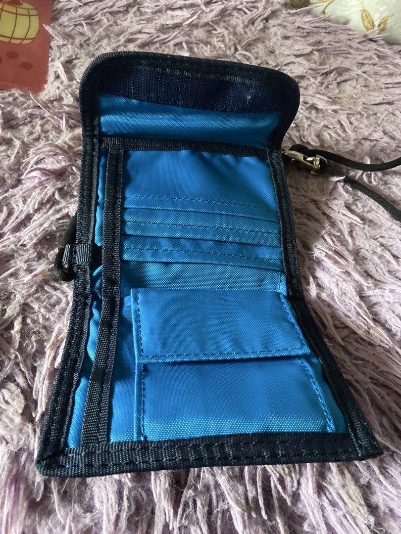 Adidas Blue Wallet with Lanyard (Category: Wallets & Card holders) located in Davao. Submitted by mengsmixitems (Listing ID 1460786601, Image 3). Description: - Blue Adidas wallet with classic black stripes. - Multiple card slots for all your cards. - Convenient coin pouch inside. - Includes a detachable black lanyard strap. - Perfect for organizing essentials for everyday or travel..