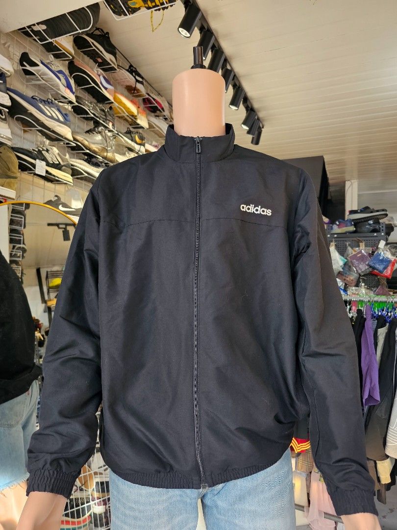 Adidas full zip track jacket (Category: Coats, Jackets and Outerwear) located in Baguio. Submitted by kayeonlineshop (Listing ID 1460767710, Image 2). Description: -black Adidas full-zip track jacket featuring a stand-up collar and a small white logo on the chest. -measurements included in the photos.