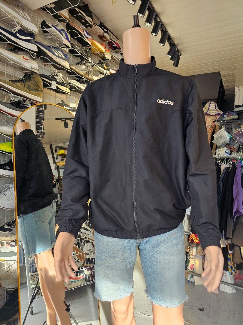 Adidas full zip track jacket (Category: Coats, Jackets and Outerwear) located in Baguio. Submitted by kayeonlineshop (Listing ID 1460767710, Image 1). Description: -black Adidas full-zip track jacket featuring a stand-up collar and a small white logo on the chest. -measurements included in the photos.