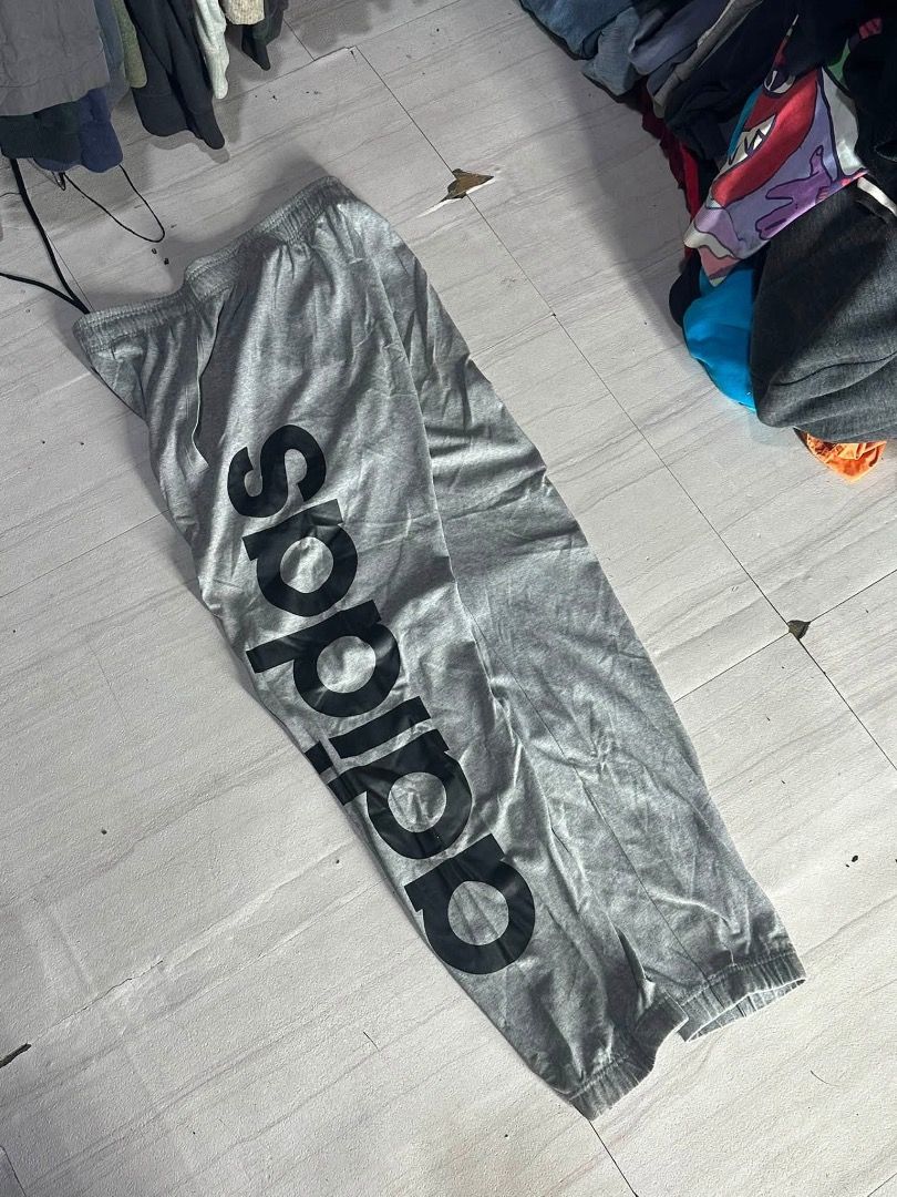 Adidas gray sweatpants (Category: Joggers) located in Manila. Submitted by nb_thriftshop (Listing ID 1460896369, Image 2). Description: adi sweat pants waist 27 to 35 has lace and garter length 40 leg hole 12 no issue need wash.