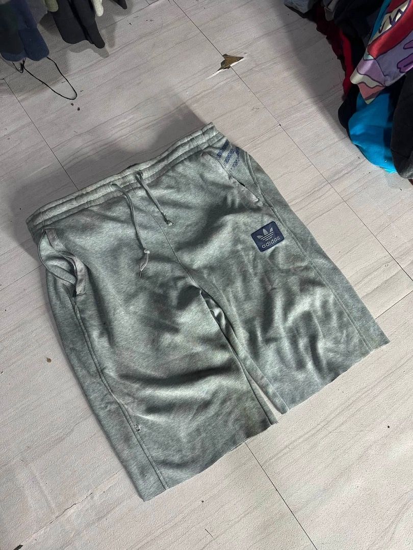 Adidas gray sweatshort (Category: Shorts) located in Manila. Submitted by nb_thriftshop (Listing ID 1460897245, Image 1). Description: adi short waist 30 to 44 has lace and garter length 24 leg hole 10 issue : 1 pencil hole na nakatahi .