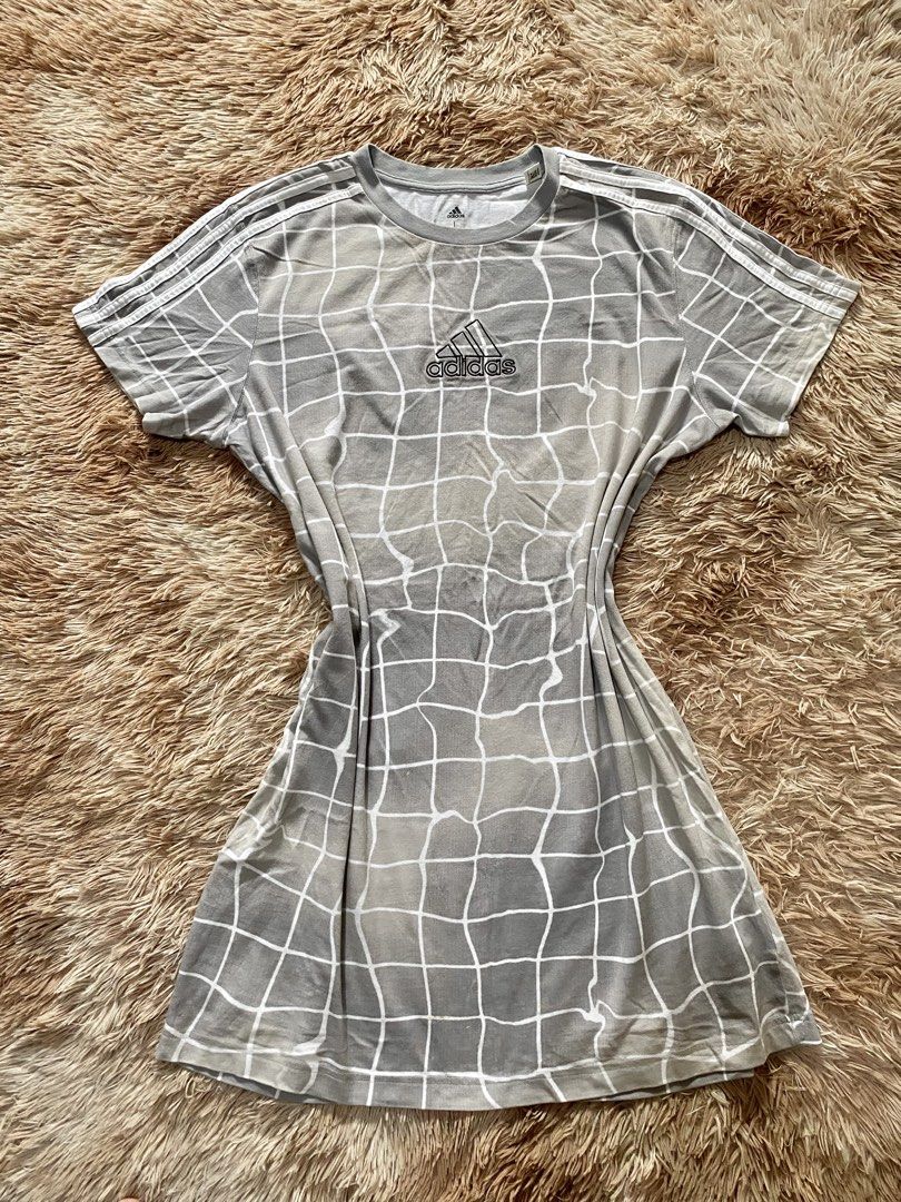 Adidas Grey Grid Pattern T-shirt Dress (Category: Dresses) located in Manila. Submitted by stormibutterfly26 (Listing ID 1460816266, Image 1). Description: L on tag Grey Adidas t-shirt dress with white grid pattern. Features Adidas stripes and logo. 100% cotton, made in Indonesia. Perfect for casual wear..
